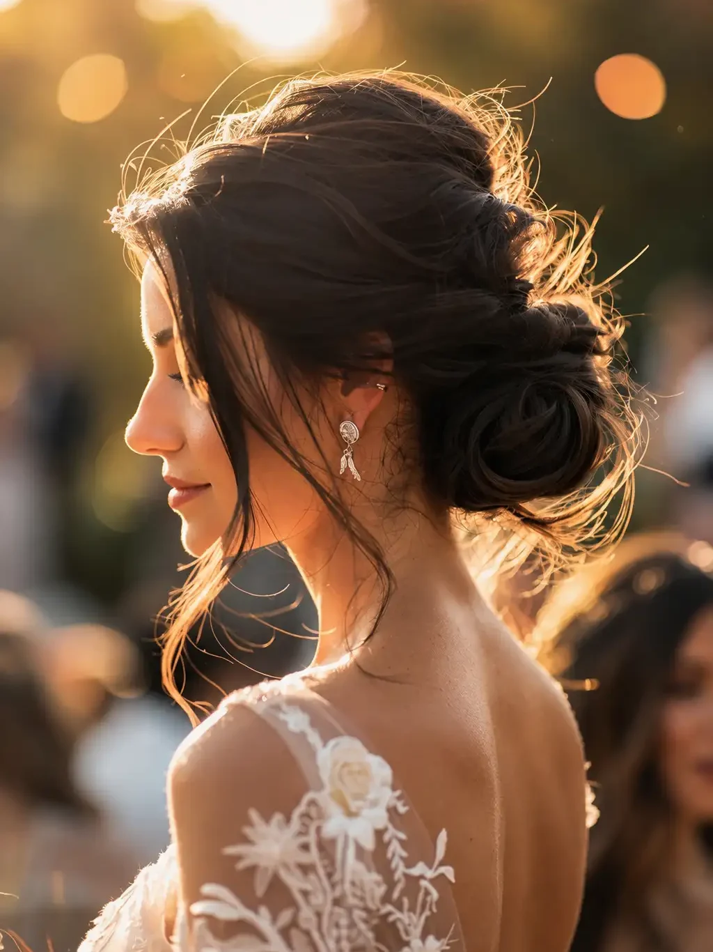 Romantic textured messy bun wedding hairstyle