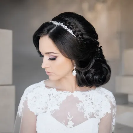 Romantic side bun wedding hairstyle